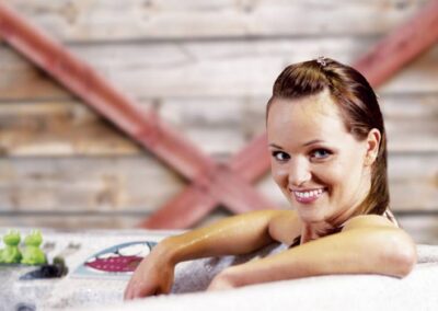 Smiling woman in aa Arctic Spas hot tub