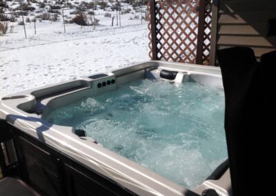Arctic Spas hot tub in the backyard in winter